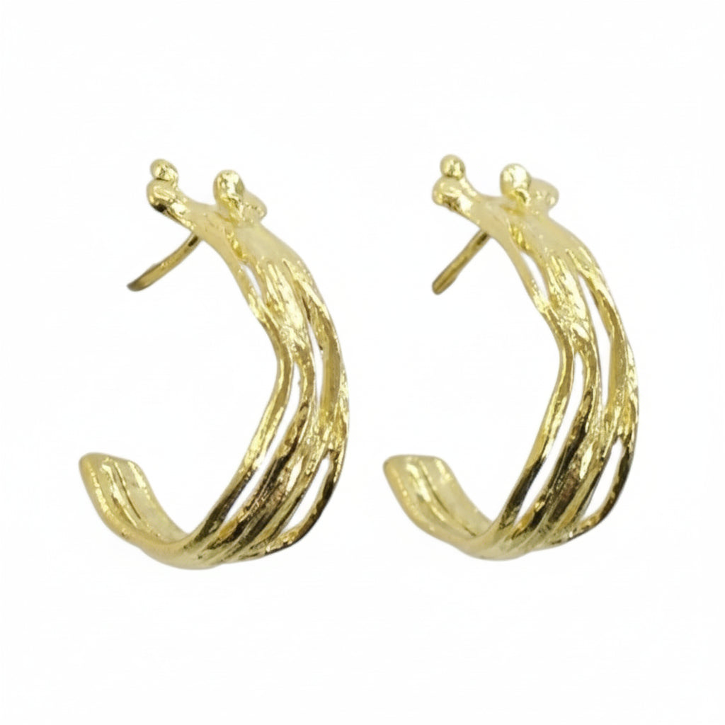Gold hoop earrings on a white background