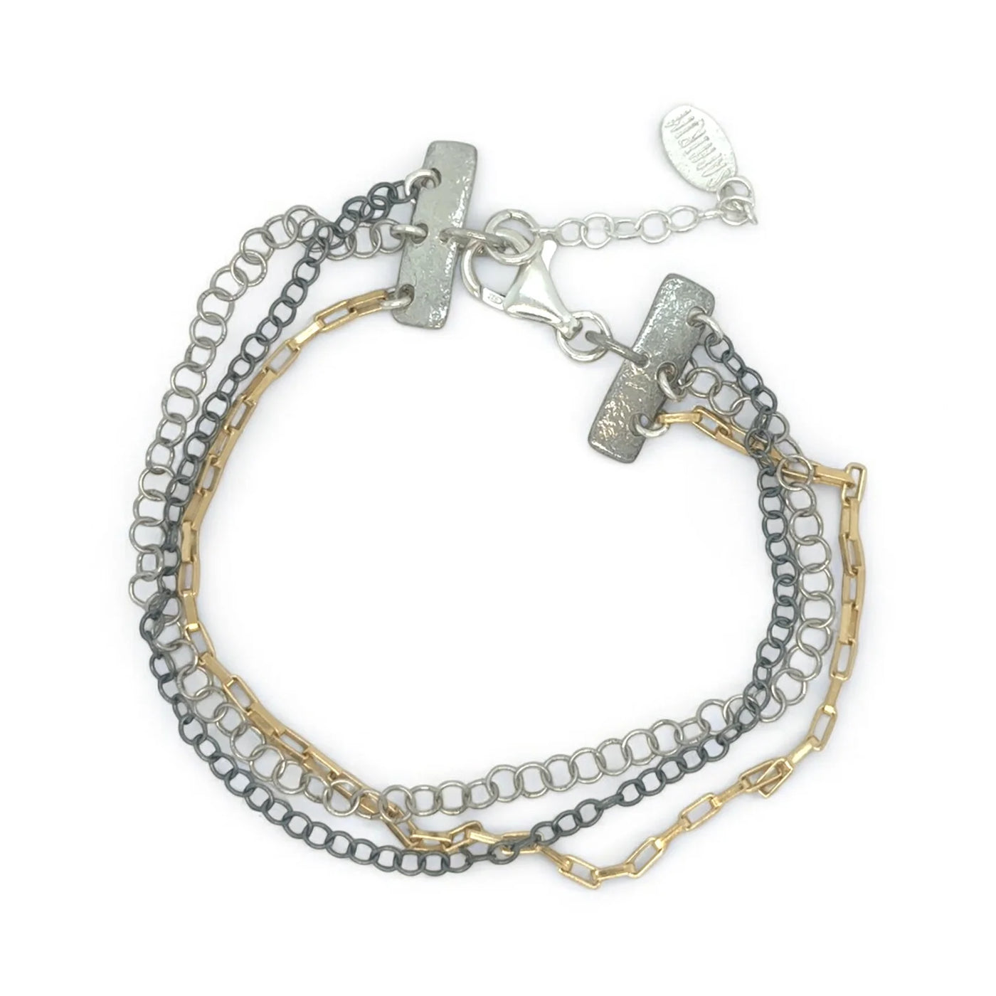 Stack of three chain bracelets in silver, gold, and gray on a white background