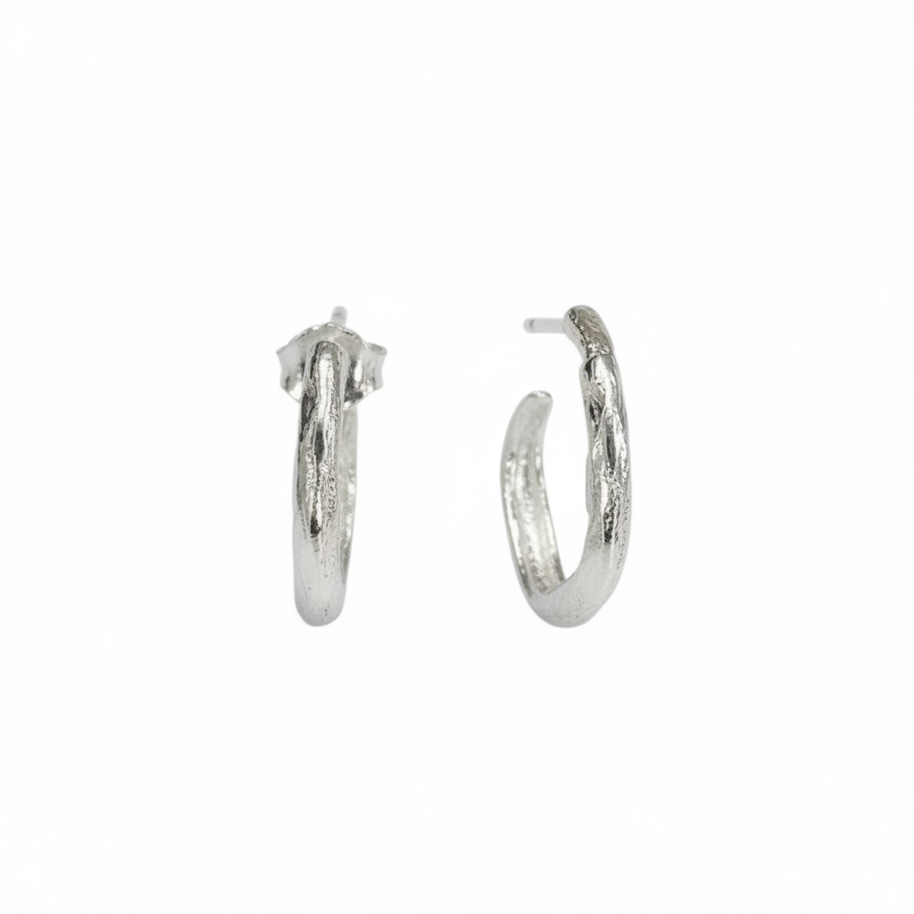 Silver hoop earrings on a white background