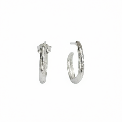 Silver hoop earrings on a white background