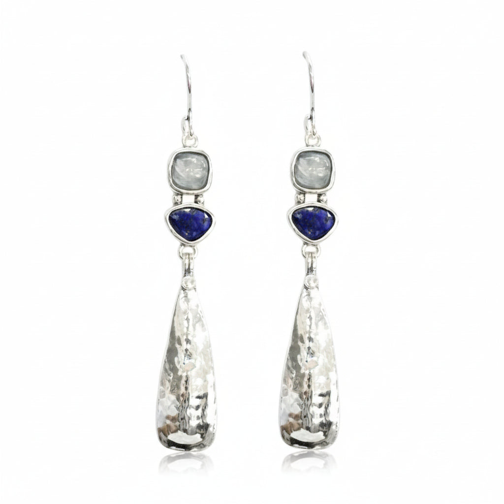 Pair of earrings with teardrop-shaped crystals and heart-shaped gemstones on a white background