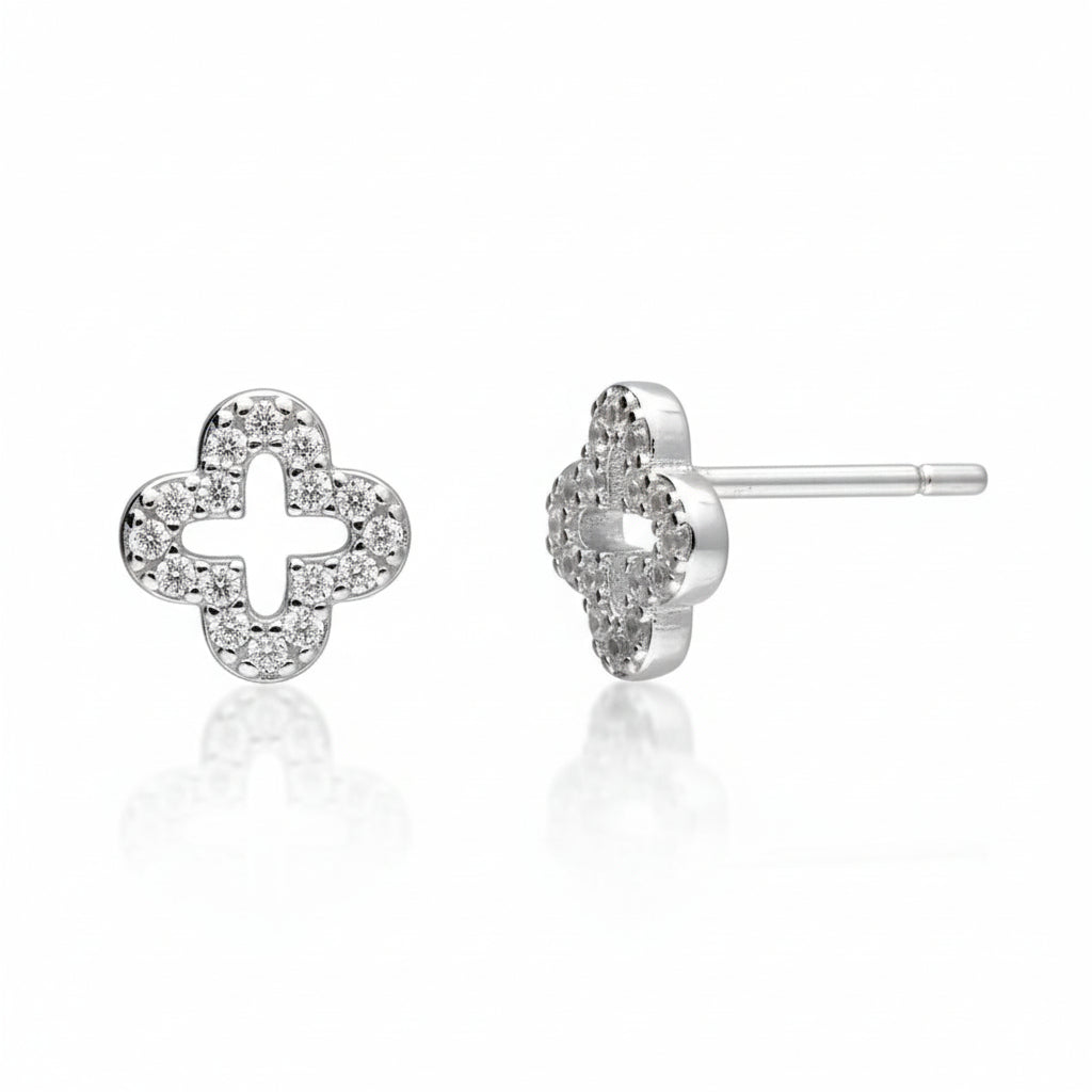 Silver clover-shaped earrings with clear stones on a white background