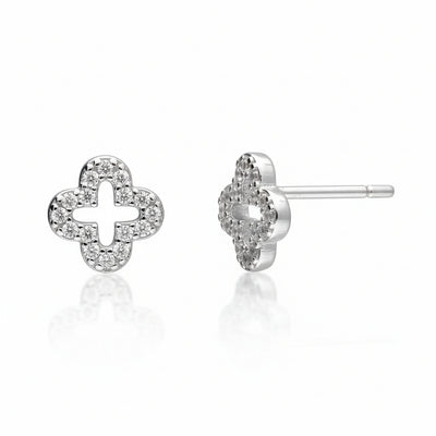 Silver clover-shaped earrings with clear stones on a white background