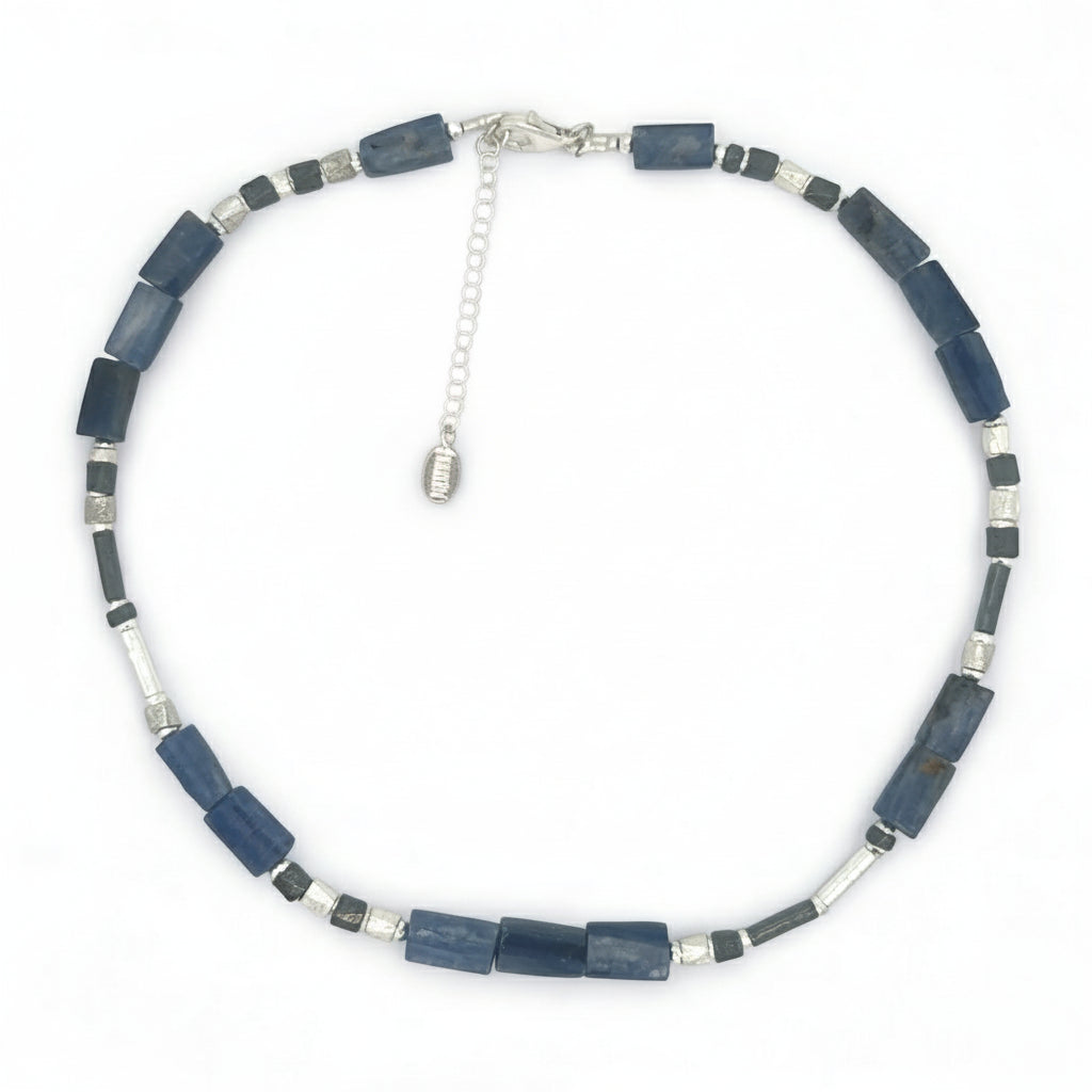 Necklace with blue and silver beads on a white background