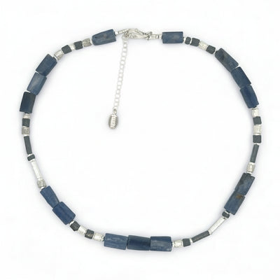 Necklace with blue and silver beads on a white background
