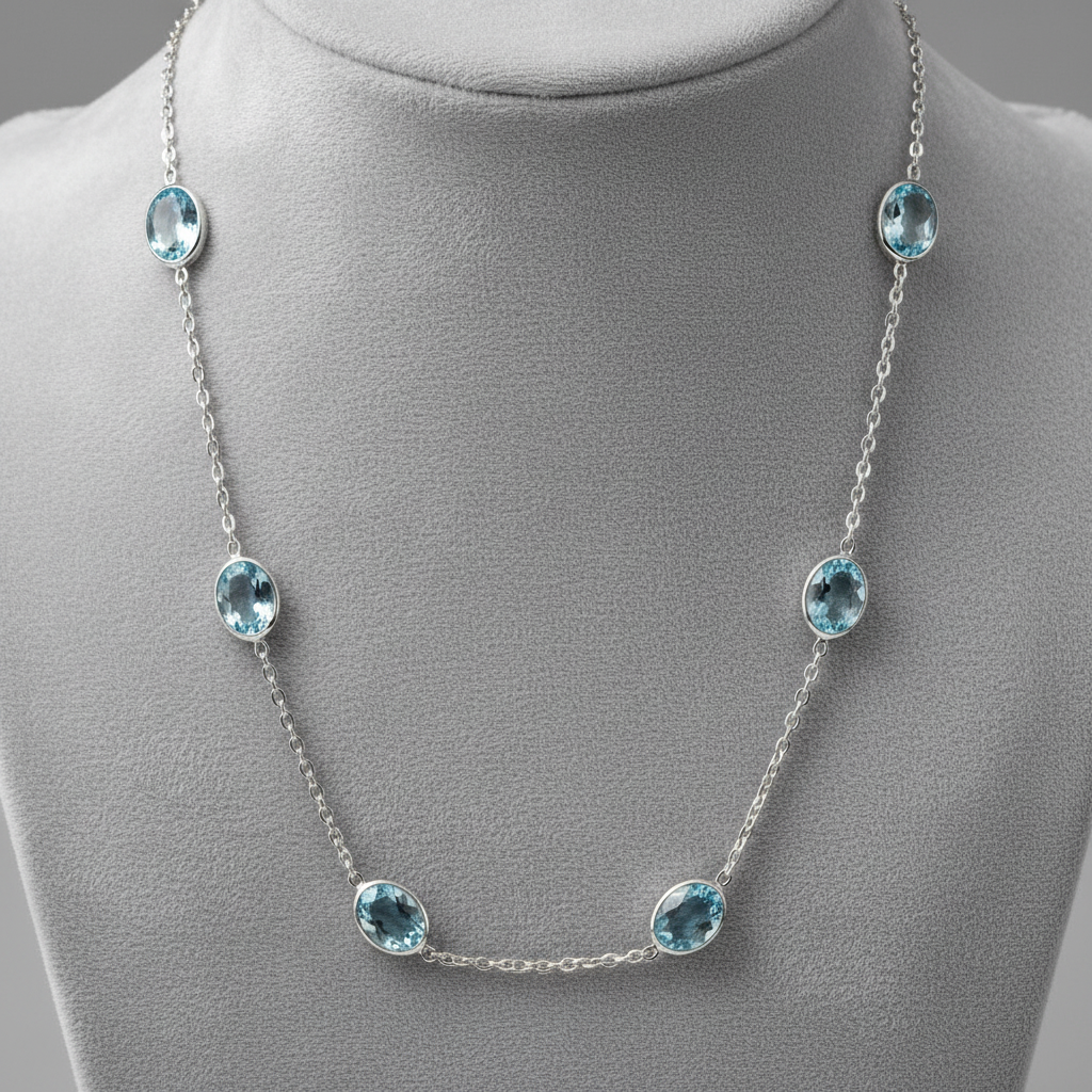 Necklace with oval-shaped gemstones on a white background