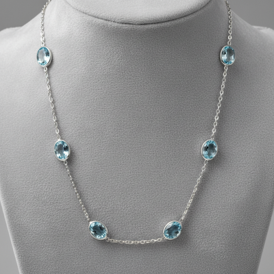 Necklace with oval-shaped gemstones on a white background