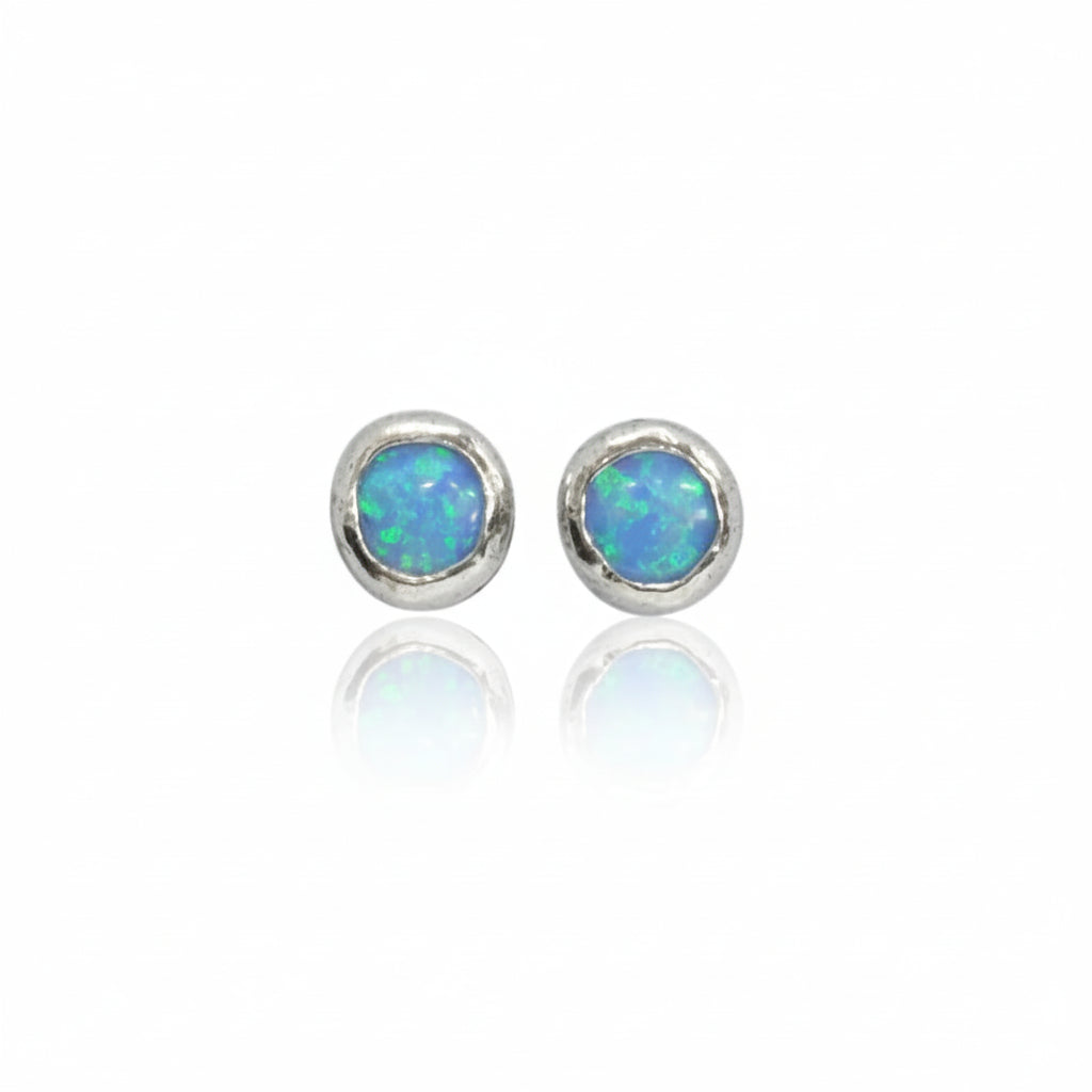 Pair of opal stud earrings on a white background