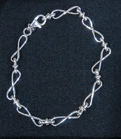 Sterling Silver Row of Infinity Twist Links Bracelet - Rococo Jewellery