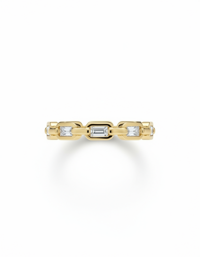 Gold ring with embedded diamonds on a white background