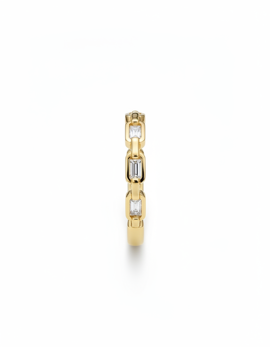Gold ring with embedded diamonds on a white background
