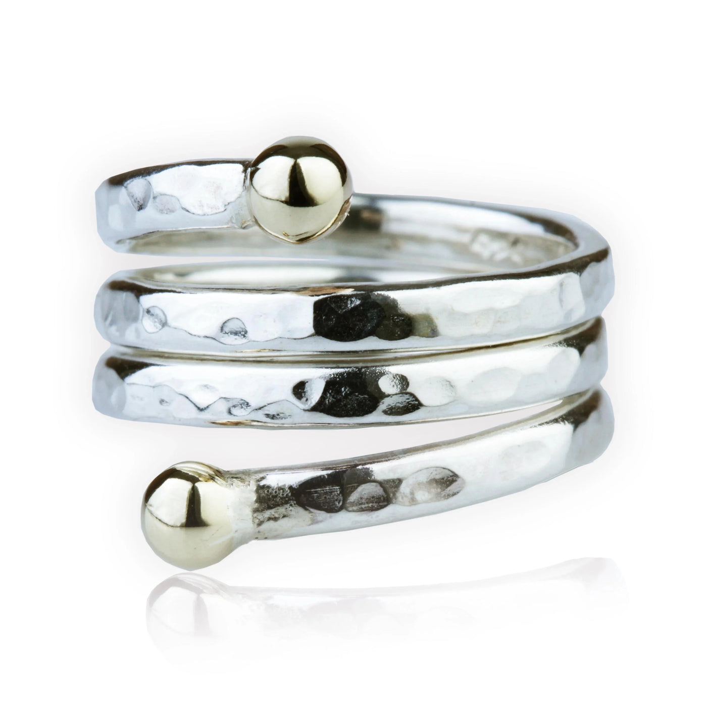 Silver spiral ring with gold beads on a white background.