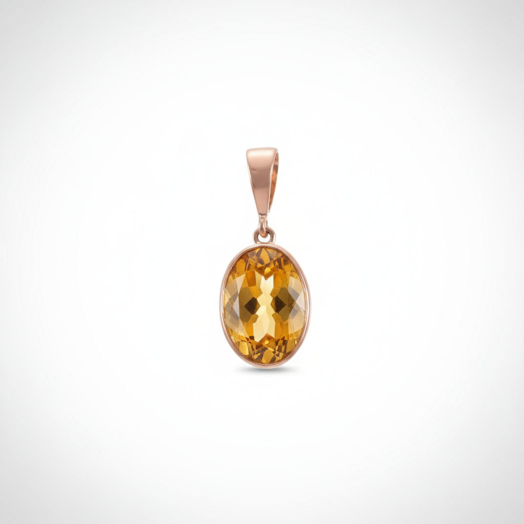 Gold pendant with a yellow citrine gemstone on a white background