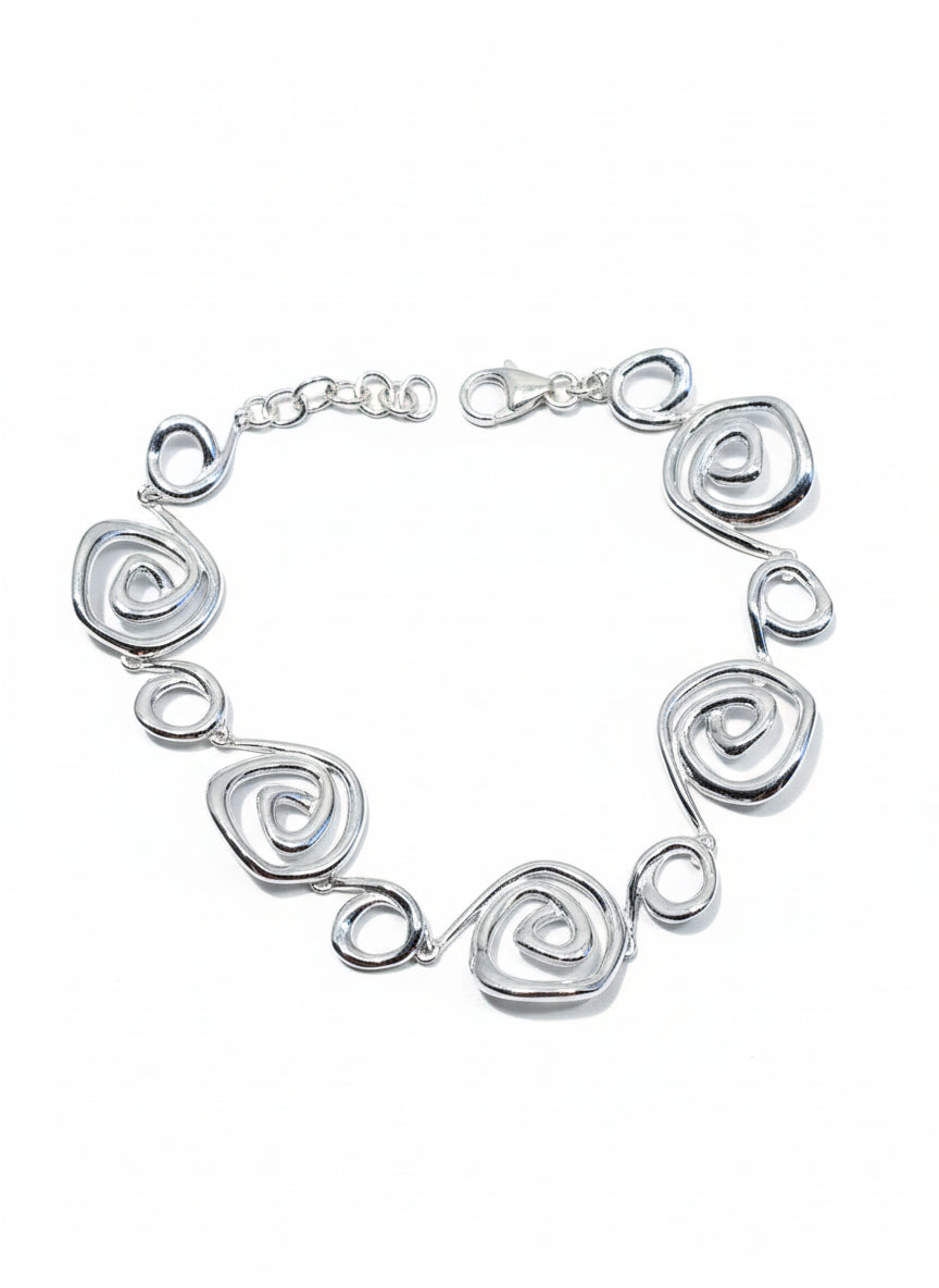 Silver bracelet with spiral design on a white background