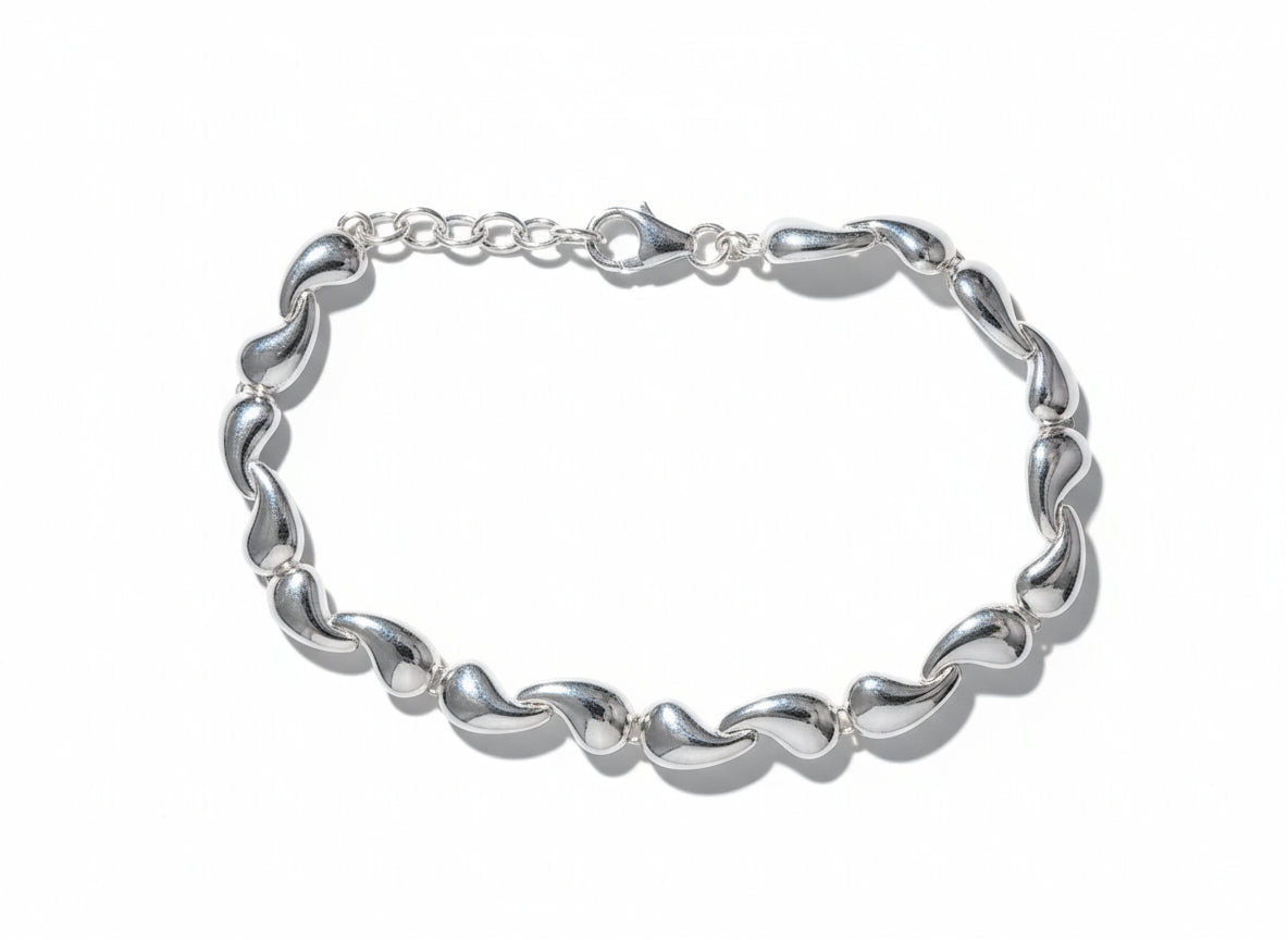 Silver bracelet on a wooden surface