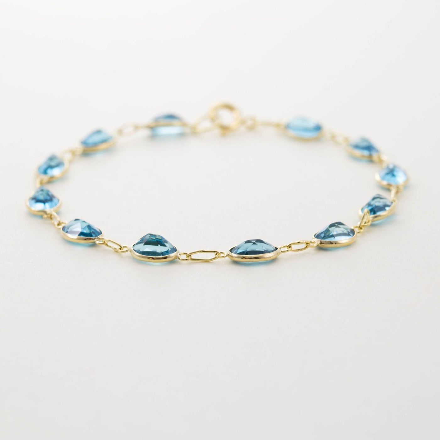 9ct Yellow Gold Bezel Set Blue Topaz Ovals Bracelet - Rococo Jewellery