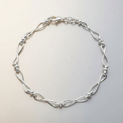 Sterling Silver Row of Infinity Twist Links Bracelet - Rococo Jewellery
